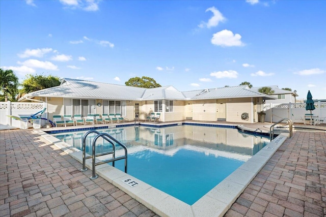 view of swimming pool featuring a patio area