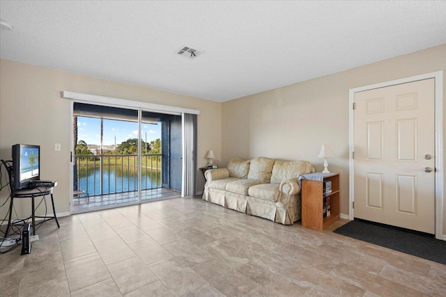 living room featuring a textured ceiling