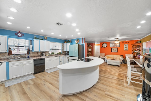 kitchen with ceiling fan, sink, black appliances, light hardwood / wood-style floors, and white cabinetry