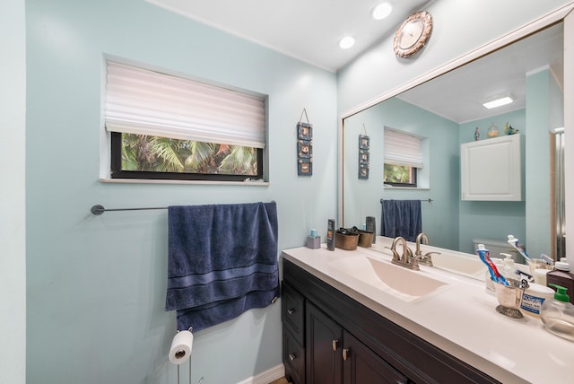 bathroom featuring vanity and toilet