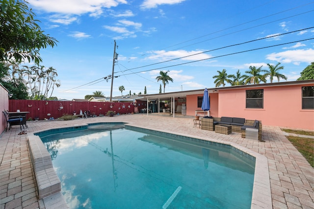 view of pool featuring an outdoor living space and a patio