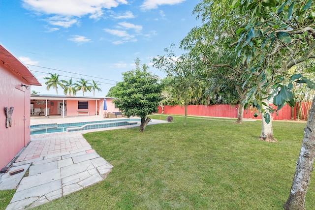 view of yard with a patio area and a fenced in pool