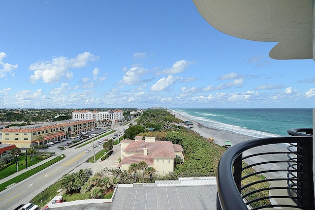 bird's eye view featuring a water view and a view of the beach