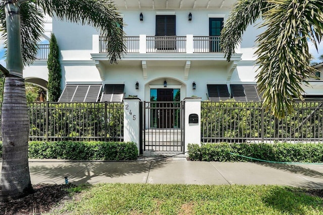 view of front of home with a balcony