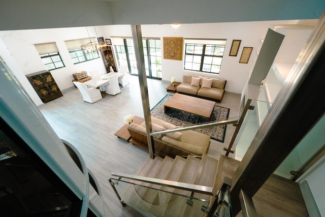 living area featuring an inviting chandelier and wood finished floors