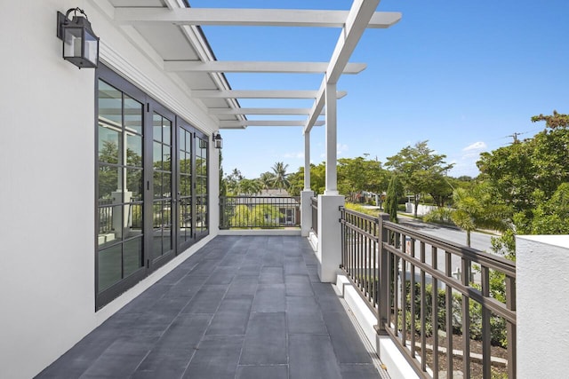 balcony featuring a pergola