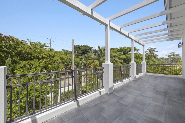 view of patio / terrace featuring a balcony and a pergola