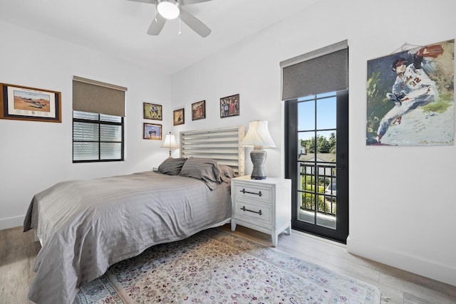 bedroom with baseboards, a ceiling fan, light wood-style flooring, and access to exterior