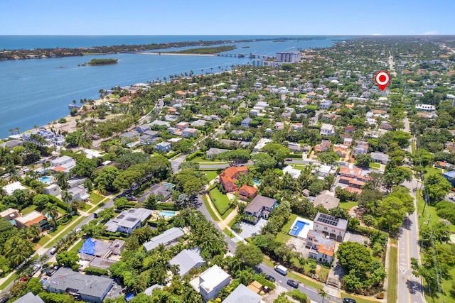drone / aerial view with a residential view and a water view