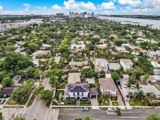 bird's eye view featuring a residential view and a water view