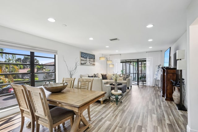 dining area featuring light wood-type flooring