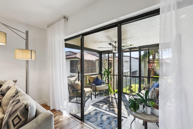 entryway with ceiling fan, hardwood / wood-style floors, and plenty of natural light