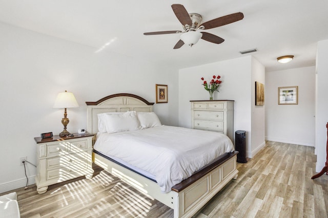 bedroom featuring ceiling fan and light hardwood / wood-style floors