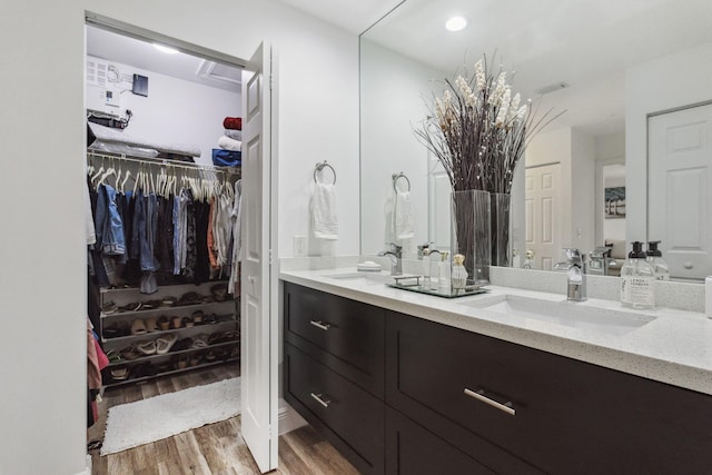 bathroom with vanity and hardwood / wood-style flooring