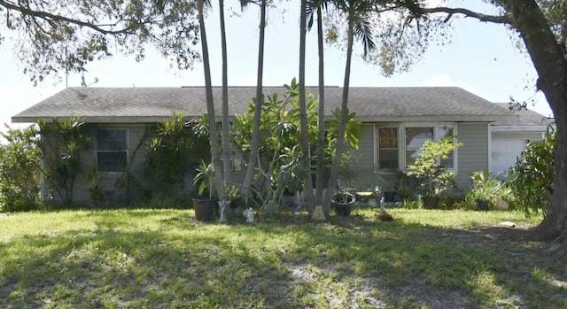 view of home's exterior featuring a lawn and a garage