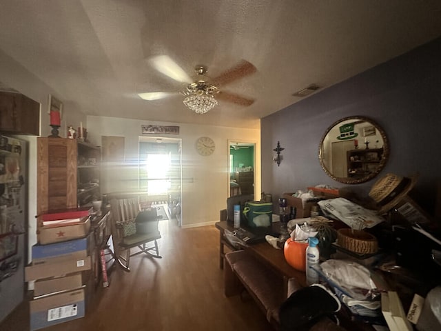 miscellaneous room featuring wood-type flooring, a textured ceiling, and ceiling fan