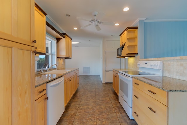 kitchen featuring sink, white appliances, light brown cabinets, and crown molding