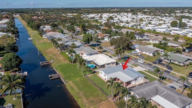 birds eye view of property featuring a water view and a residential view