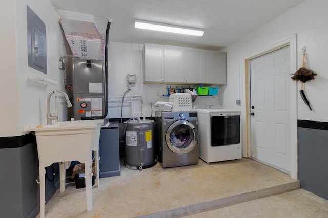 laundry area with cabinets, separate washer and dryer, electric panel, and water heater