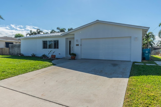 ranch-style home featuring a garage and a front yard