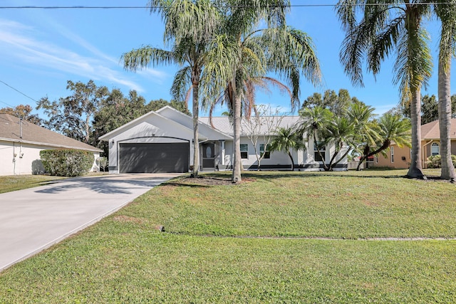 ranch-style home featuring a garage and a front yard