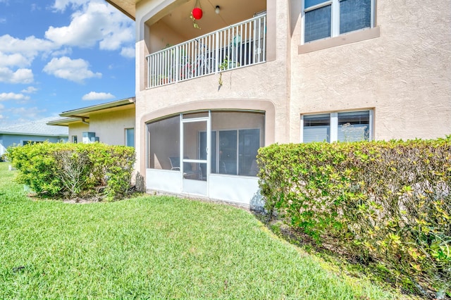 rear view of property with a lawn