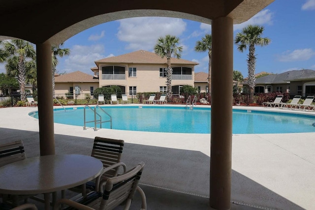 view of swimming pool with a patio