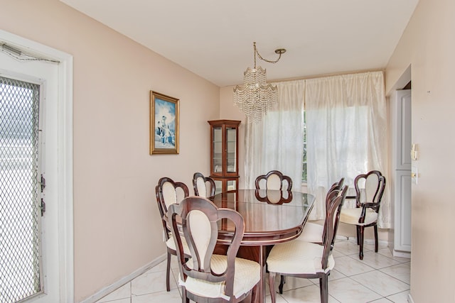 dining area featuring a notable chandelier