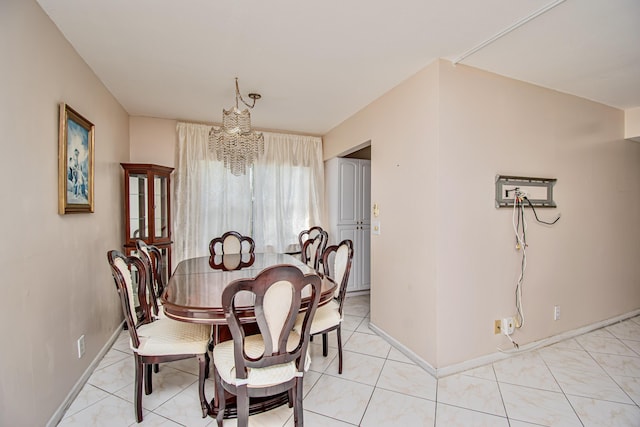 dining room with a notable chandelier