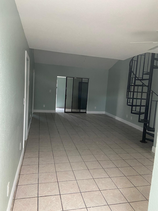 unfurnished living room featuring light tile patterned floors