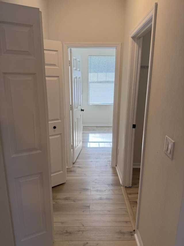 hallway with light wood-type flooring