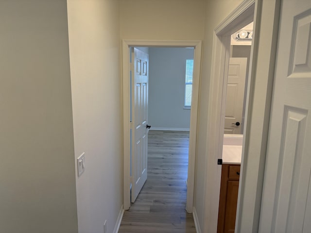 hall with light hardwood / wood-style floors