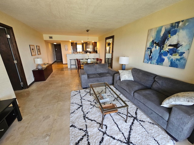 living room with a textured ceiling