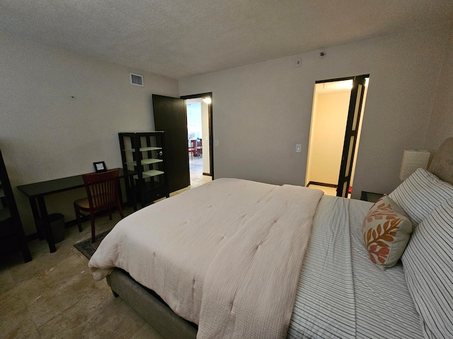 bedroom with a textured ceiling