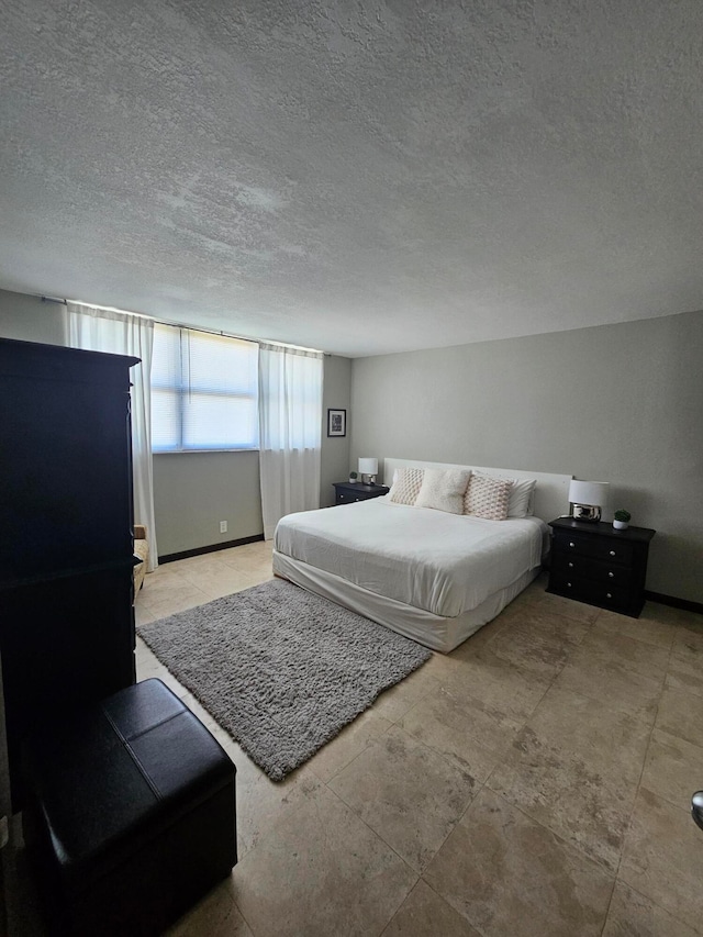 bedroom featuring a textured ceiling