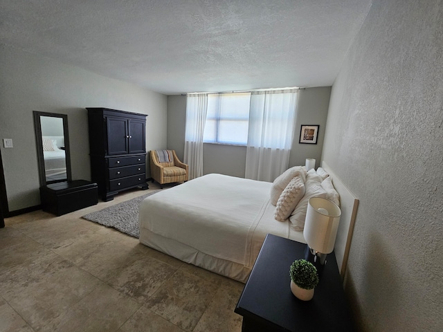 bedroom featuring a textured ceiling