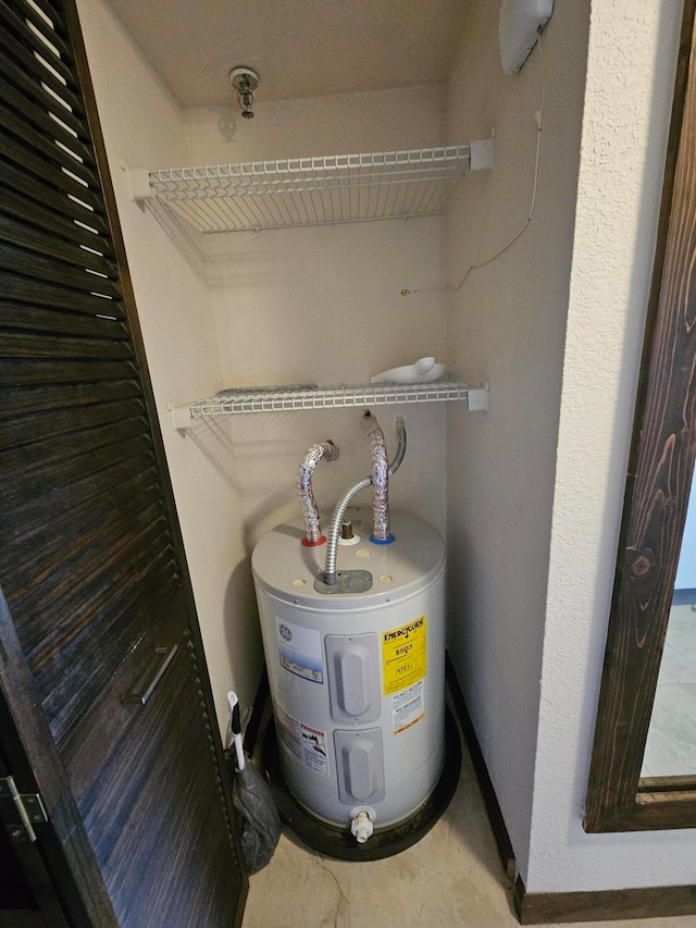 utility room with electric water heater