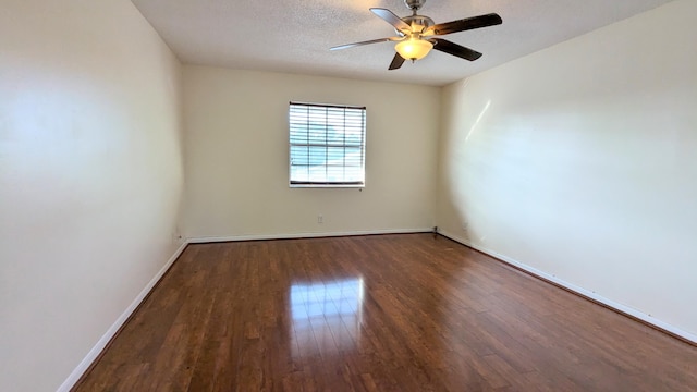 spare room with a textured ceiling, hardwood / wood-style flooring, and ceiling fan