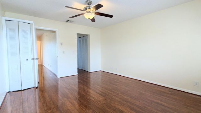 unfurnished bedroom with dark hardwood / wood-style floors and ceiling fan