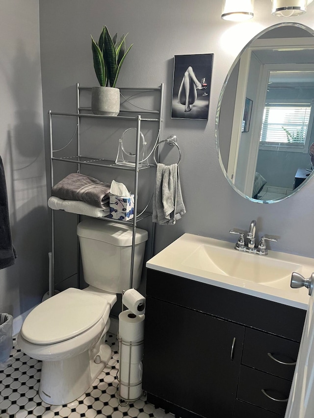 bathroom featuring vanity and toilet