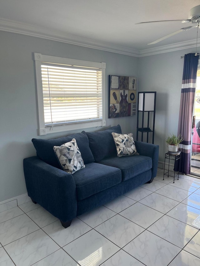 living room with ceiling fan and ornamental molding