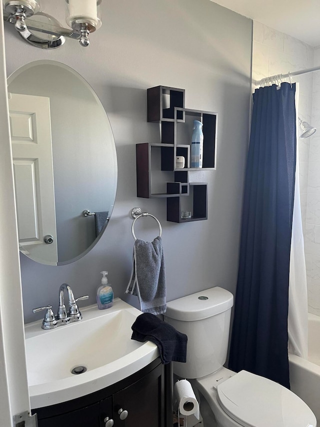 full bathroom featuring vanity, toilet, and shower / bath combo with shower curtain