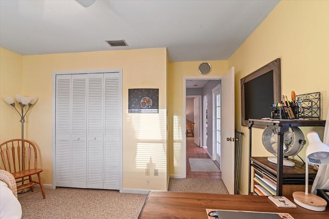 carpeted bedroom featuring a closet