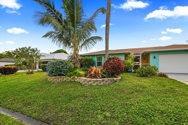 ranch-style house with a front yard and a garage