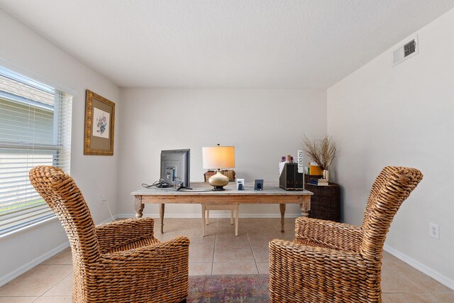 2538 12th Sq SW, Vero Beach, FL 32968 - dining area with light tile patterned floors and a textured ceiling