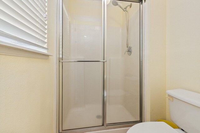 2538 12th Sq SW, Vero Beach, FL 32968 - bathroom with tile patterned flooring, vanity, toilet, and a shower with door