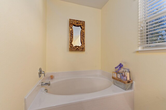 2538 12th Sq SW, Vero Beach, FL 32968 - bathroom featuring tile patterned floors and a tub to relax in