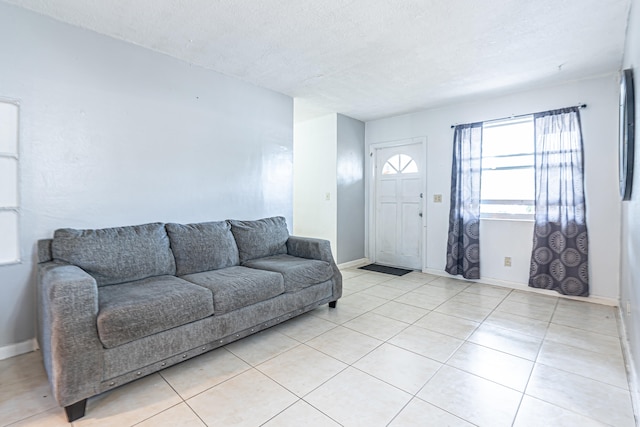 tiled living room with a textured ceiling