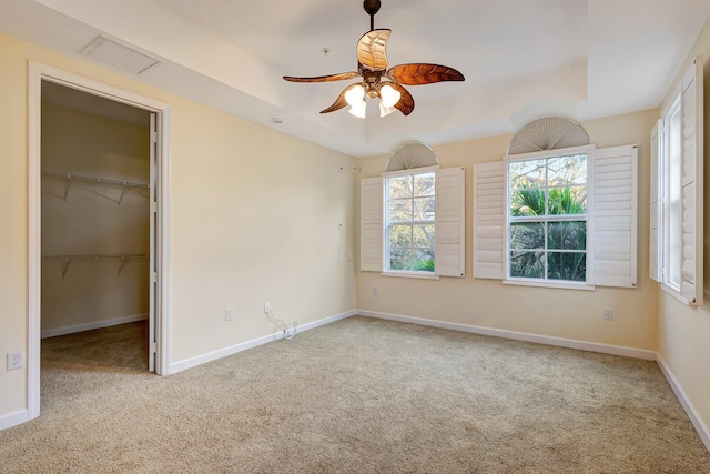 carpeted empty room with ceiling fan