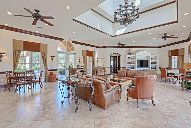 living room with crown molding, french doors, a towering ceiling, and ceiling fan with notable chandelier